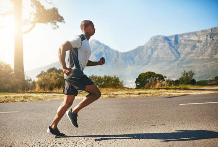 Man running with mountains in the background