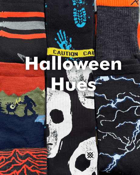 Collection of Halloween-themed socks with various designs and colors.