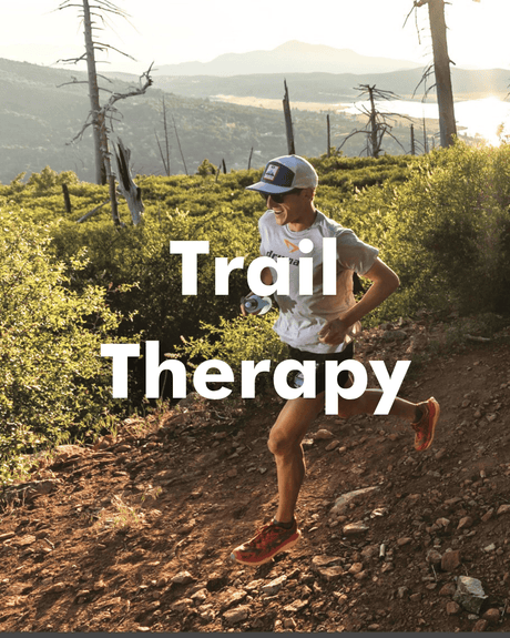 Person running on a trail with 'Trail Therapy' text overlay