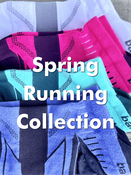 Stack of colorful running socks with text 'Spring Running Collection' on a blurred background