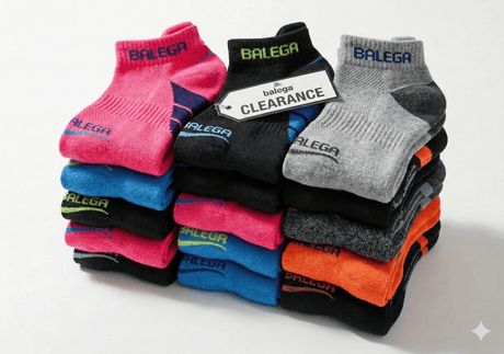 Stack of colorful socks with 'Balega CLearance' branding on a white background