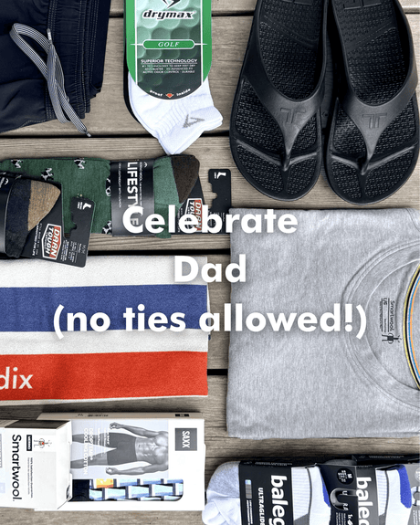 Collection of men's accessories including socks, sandals, and underwear on a wooden surface with text 'Celebrate Dad (no ties allowed!)'.